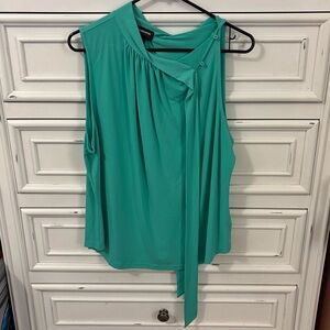 Green sleeveless blouse